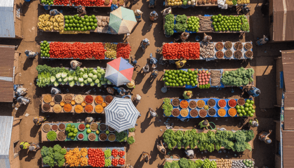 Produce stalls with market supply and pricing